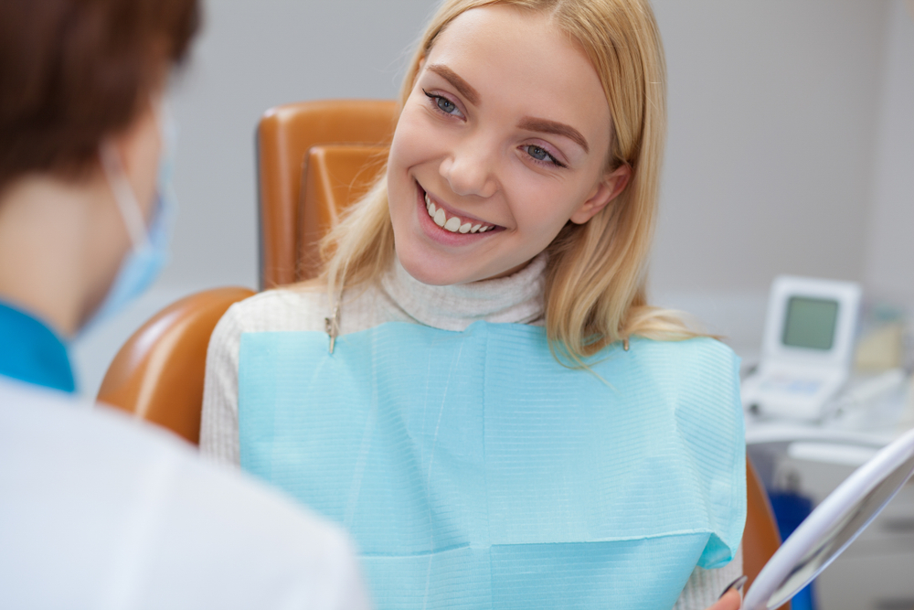 Patient Consultation About Dental Implants – Dental Implants in Johnson City, TN A smiling woman discusses her treatment with the dentist, representing professional care and lasting results through advanced dental implants in Johnson City, TN.
