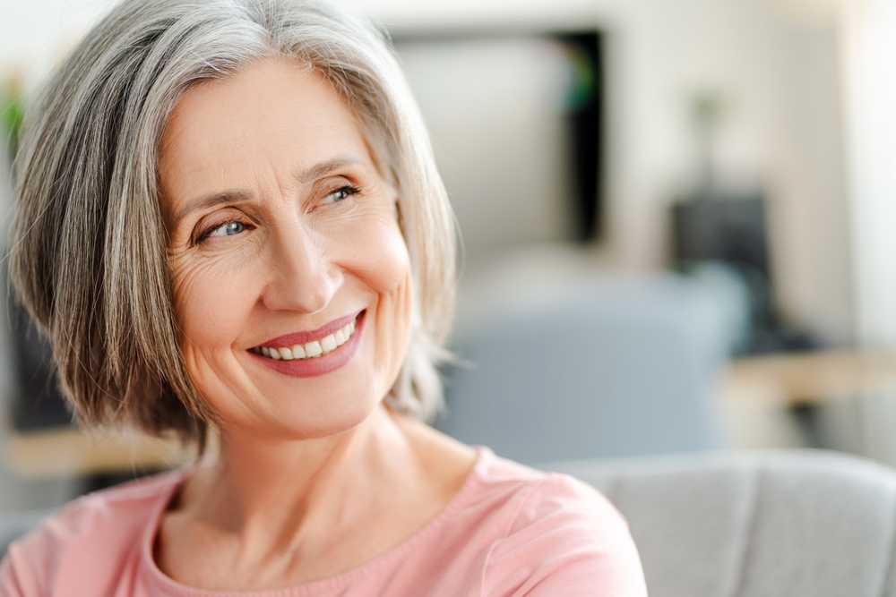 Older Woman Smiling with Natural-Looking Dentures – Dentures in Kingsport, TN A joyful mature woman smiles with confidence, reflecting the comfort, aesthetics, and stability provided by custom-crafted dentures – Dentures in Kingsport, TN.